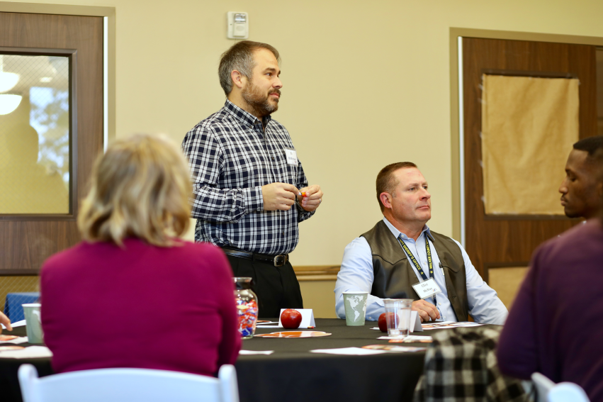 A group of CCE Advisory Board members at a meeting.